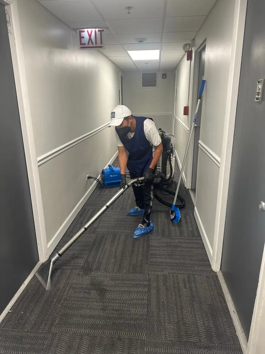 FriendlyProClean technician extracting commercial hallway carpet in Los Angeles